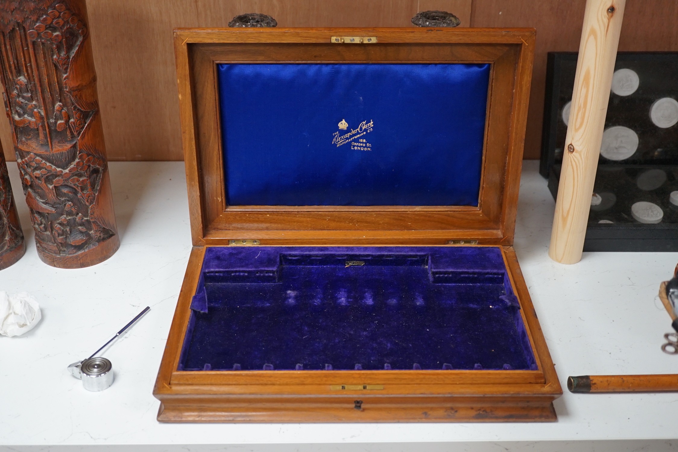 A silver mounted spirit decanter, a pair of plated candlesticks and canteen box, decanter 24 cms high